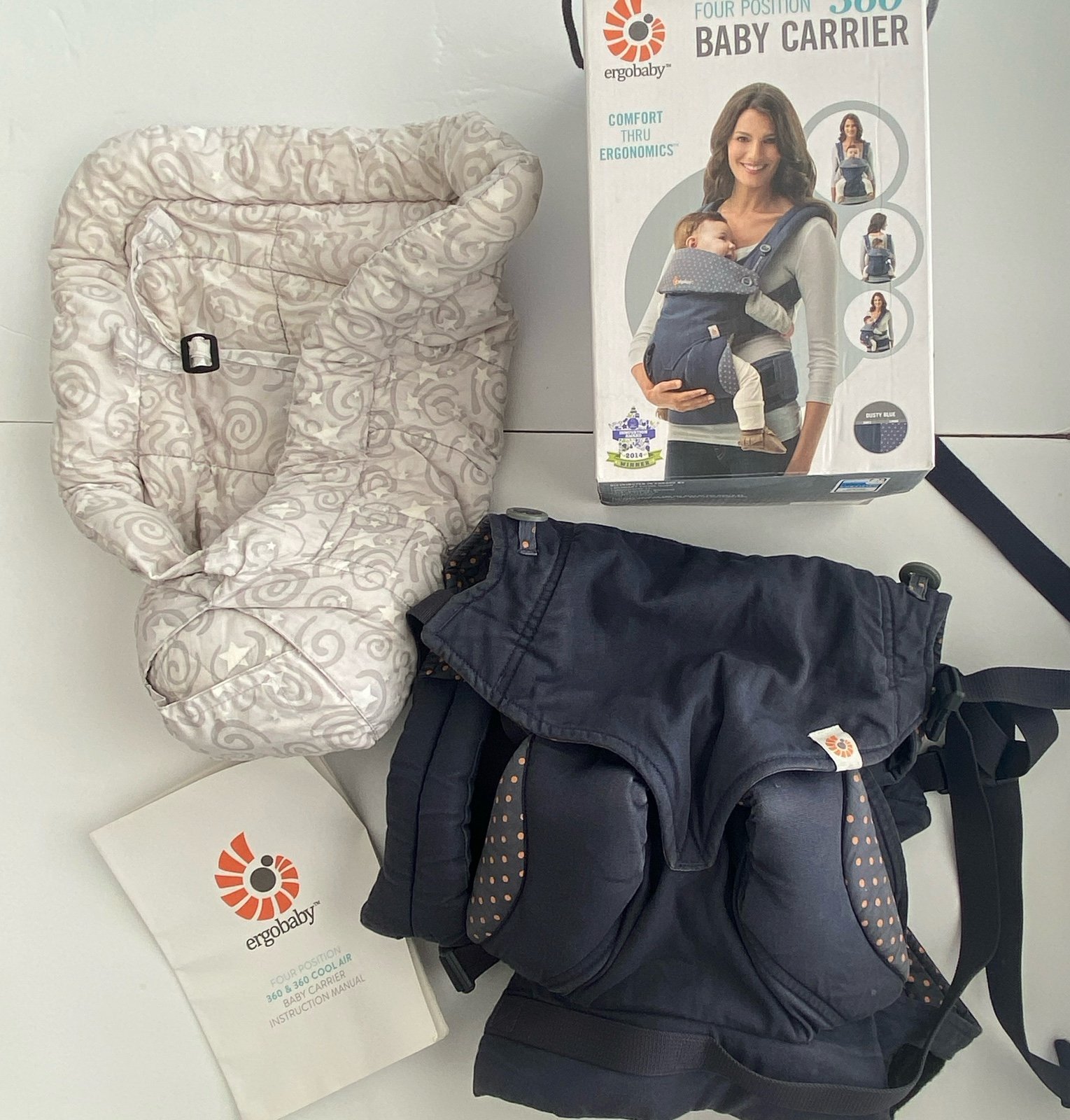 Ergo Baby four position baby carrier In dusty blue with infant insert