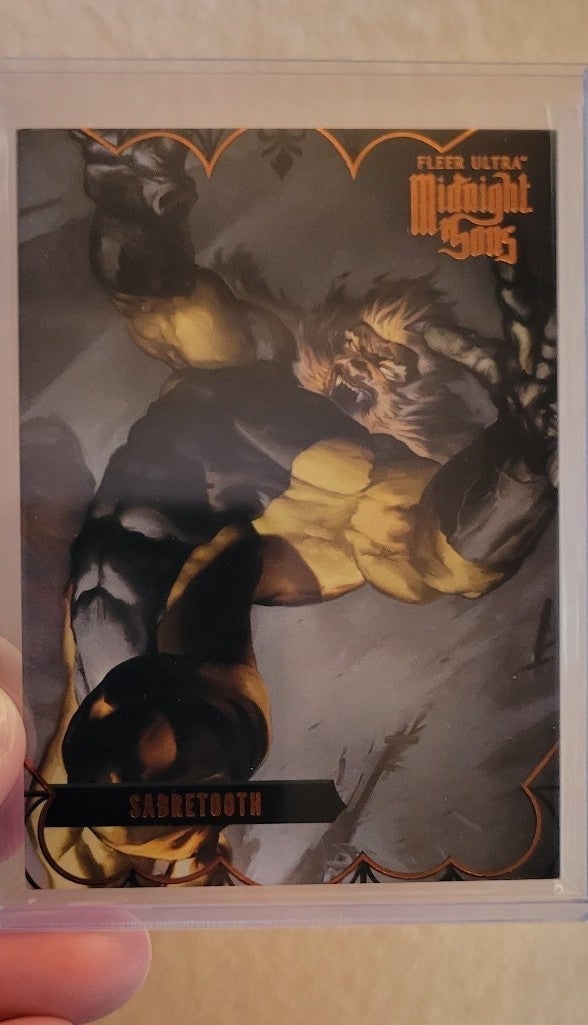 2023 Fleer Ultra Midnight Sons SABRETOOTH ORANGE PARALLEL 13/25