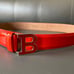 Orange red Bally leather belt.