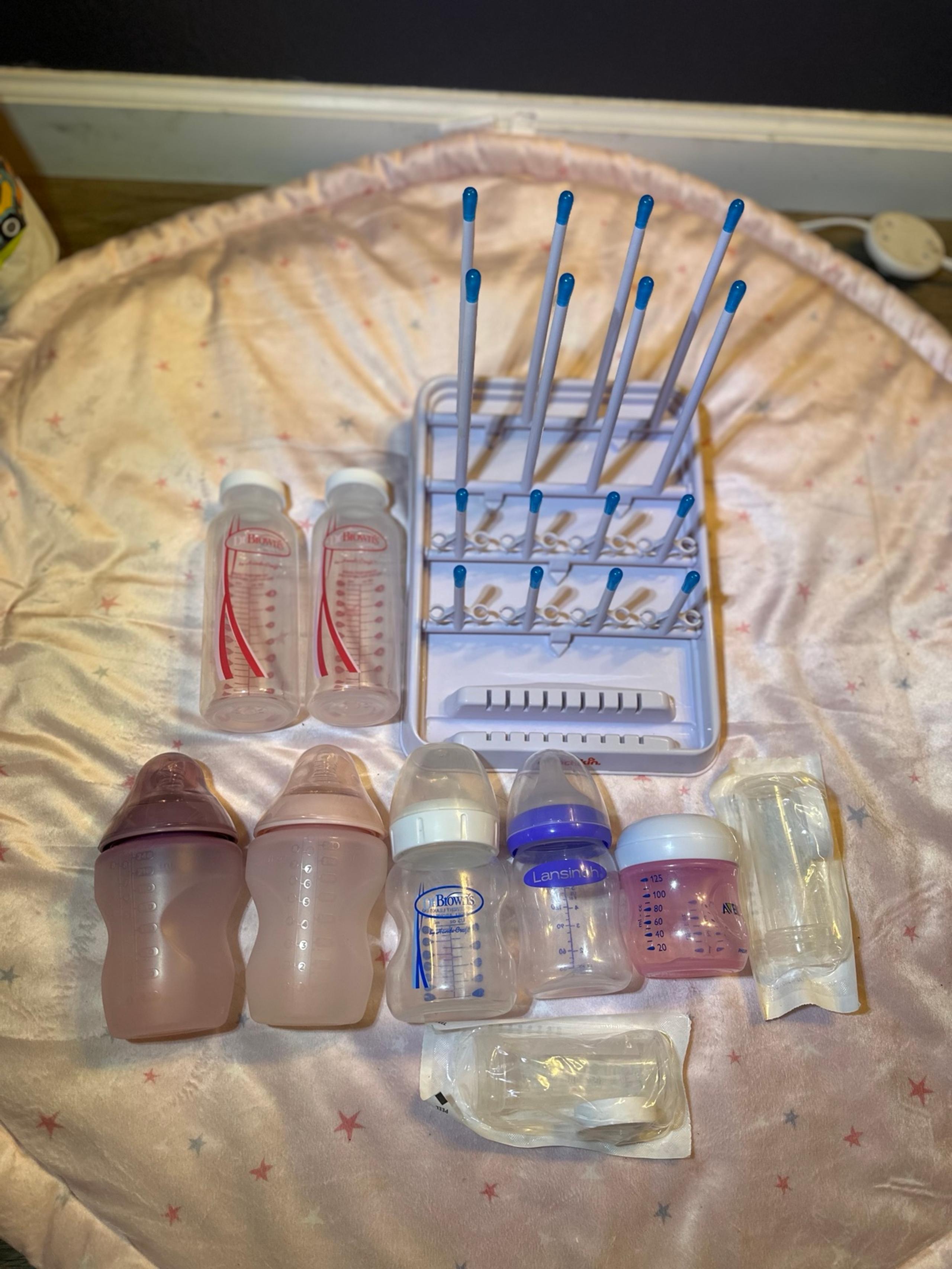 Plastic baby bottles and bottle drying rack