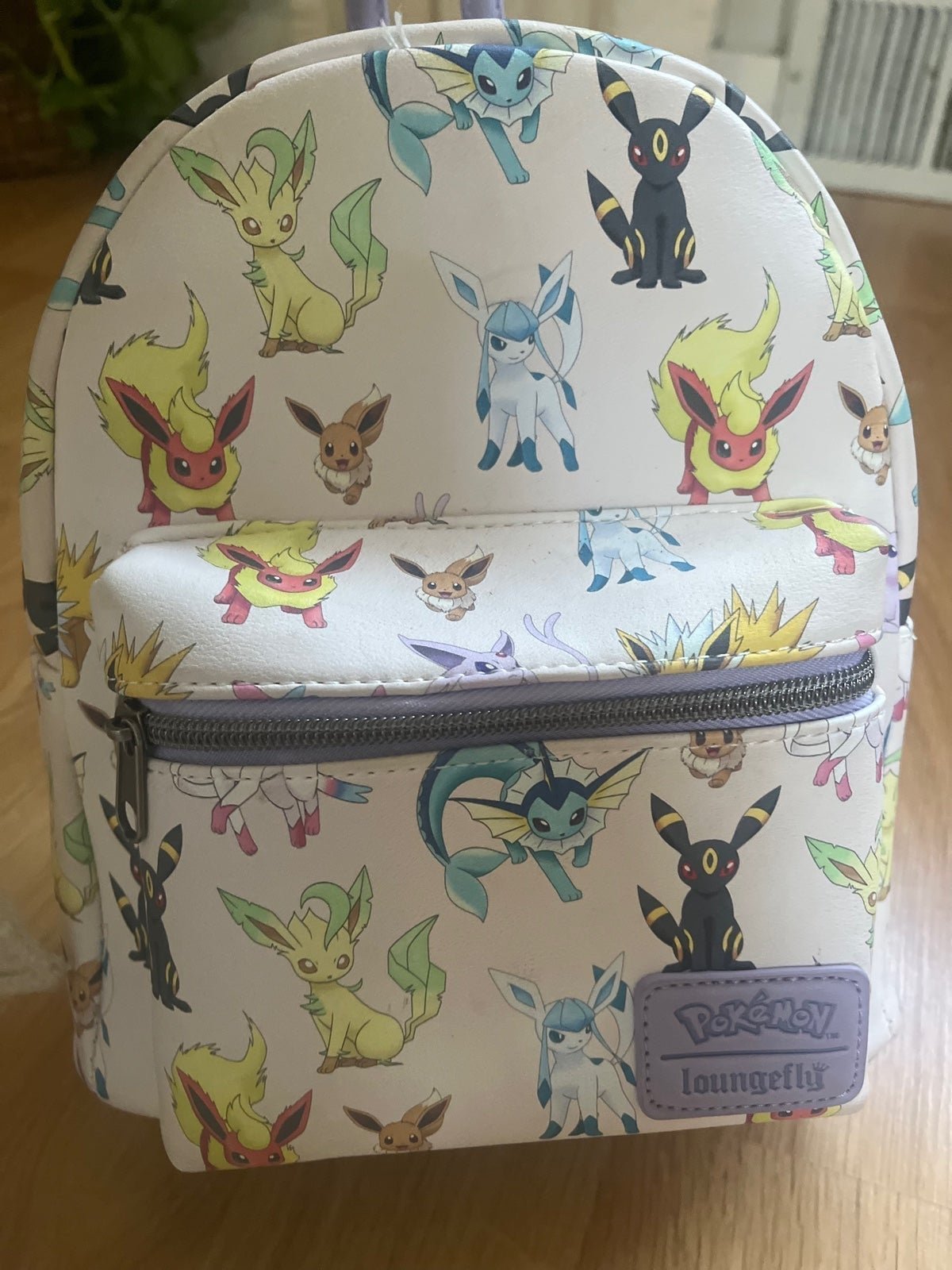 Loungefly Eevee Backpack with Pokémon cards