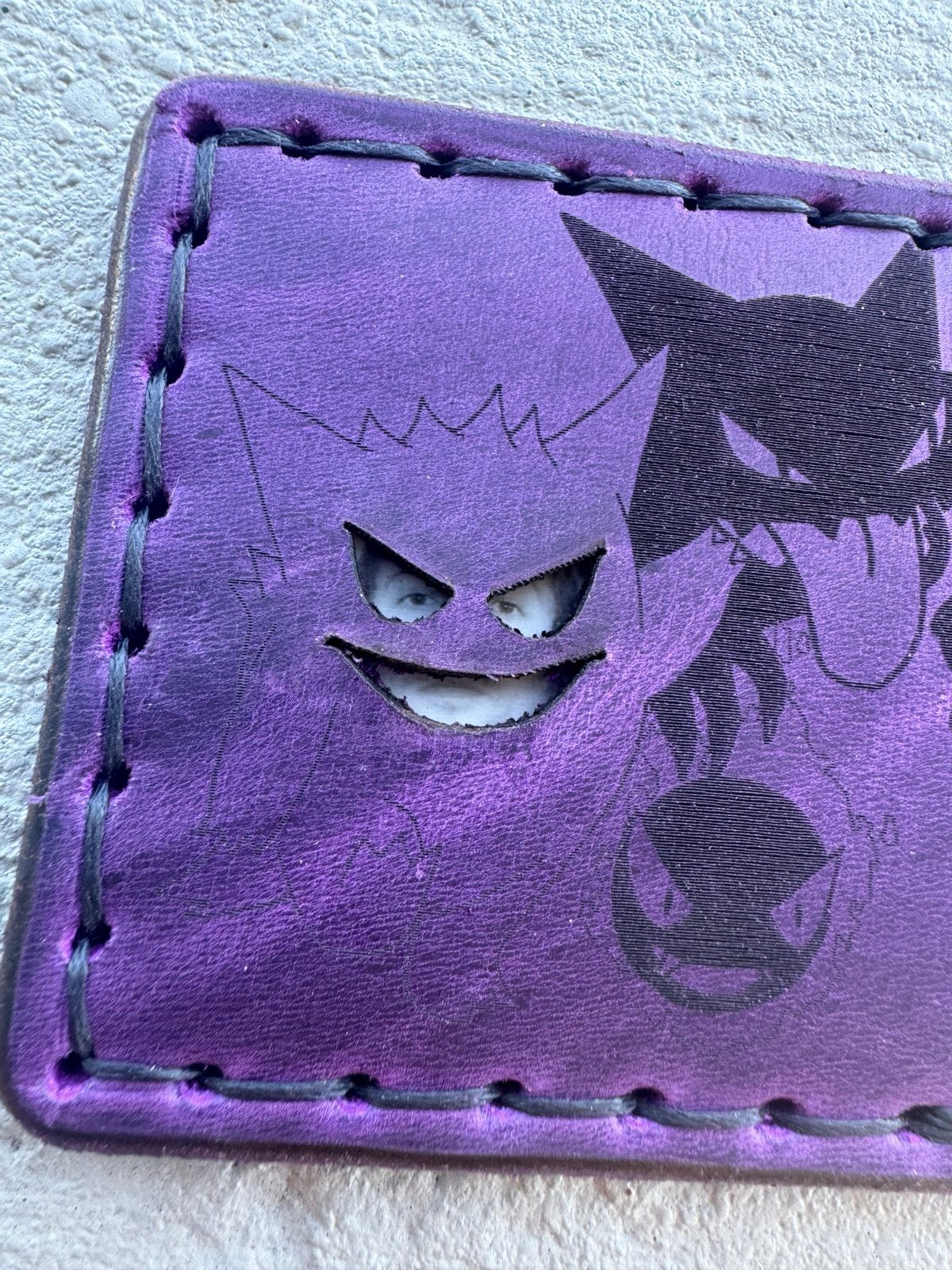 Handmade, hand sewn leather wallet card holder with face mask featuring Gengar