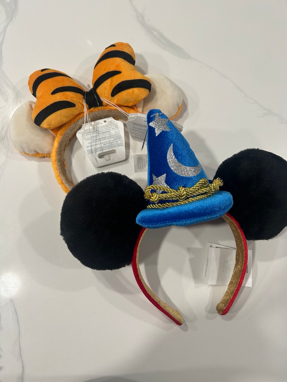 Both Fantasmic and Tigger 2025 ear headbands
