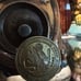 Oakwash Superstition Village Moai mug with coin