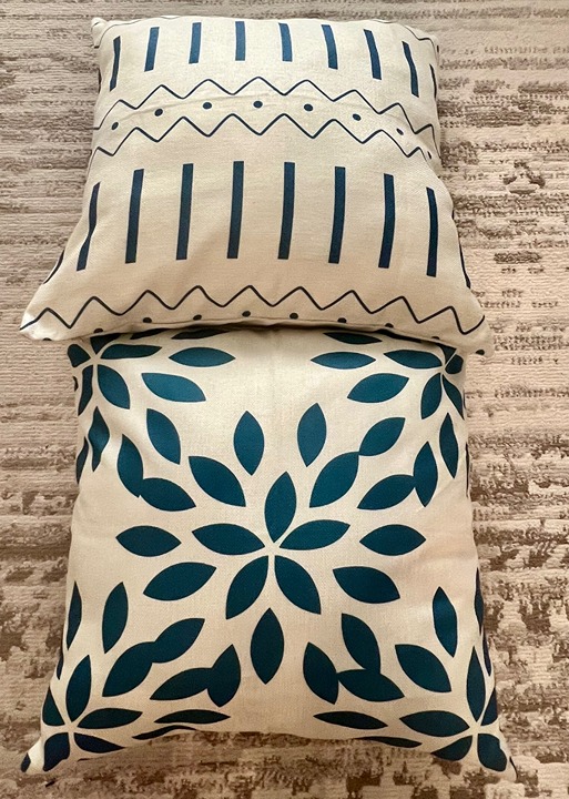 2 throw pillows, 18 by 18 inches