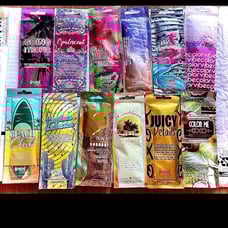 tanning lotion 12 packets and 2 bottles of Devoted Creations Vacay Vibes&Acceler