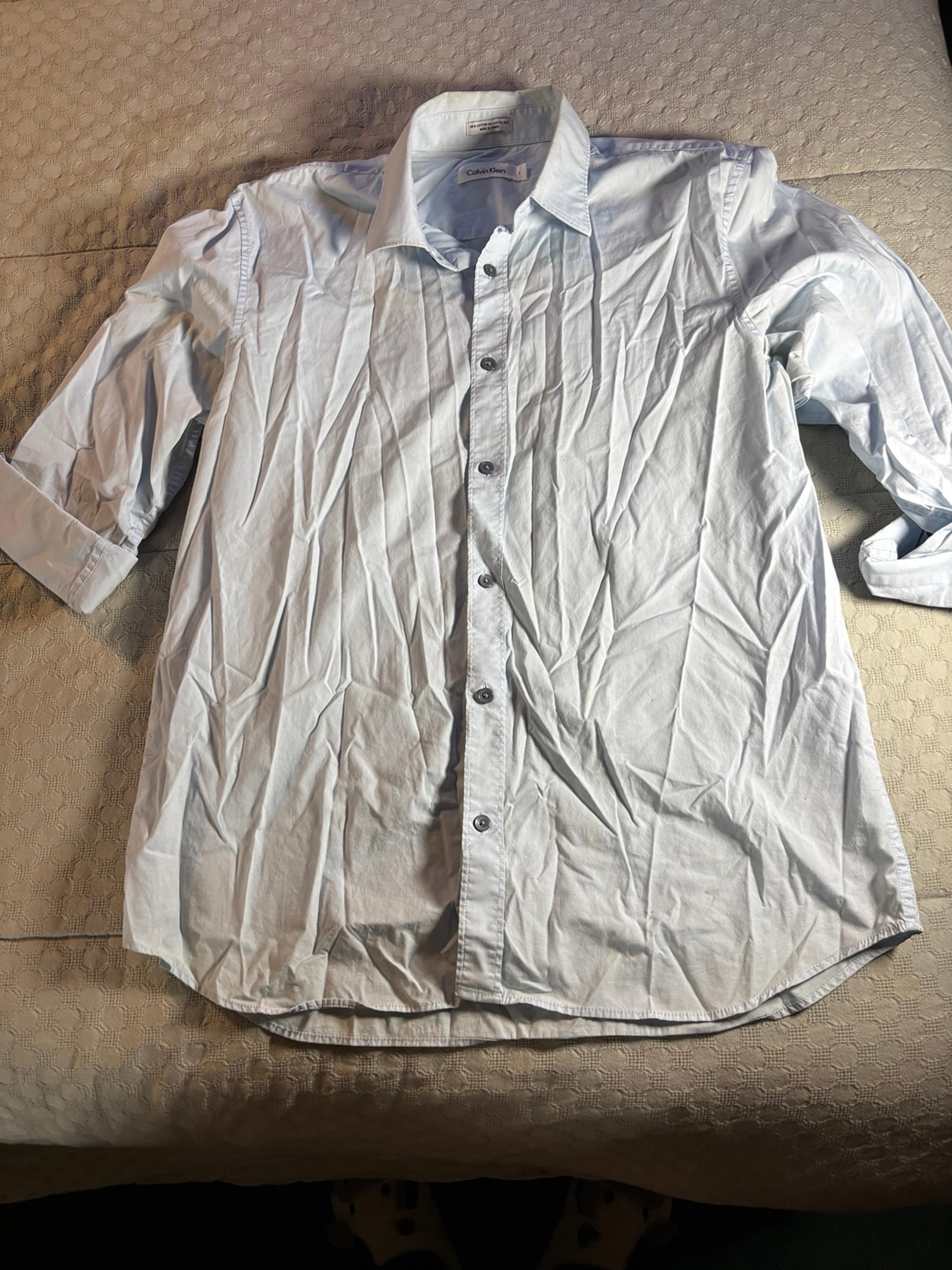 Very elegant light blue Calvin Klein button-down shirt