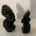 Two Two carved pieces of obsidian