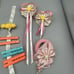 Vintage 1980s Girls Hair Clips Huge lot Flowers Words Scissors Bags Etc
