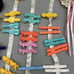 Vintage 1980s Girls Hair Clips Huge lot Flowers Words Scissors Bags Etc