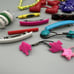 Vintage 1980s Girls Hair Clips Huge lot Flowers Words Scissors Bags Etc