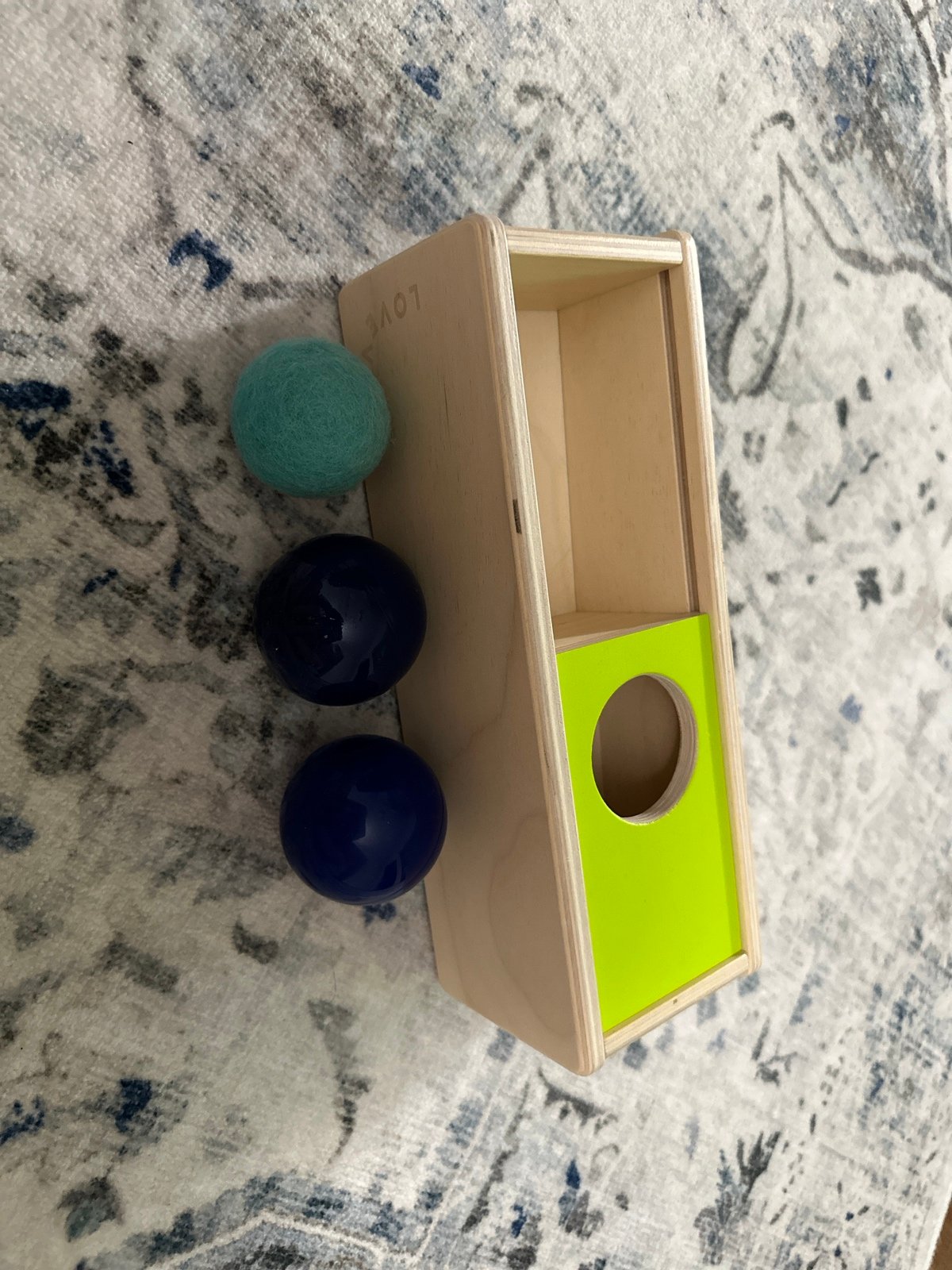 lovevery ball drop box with heavy/light balls
