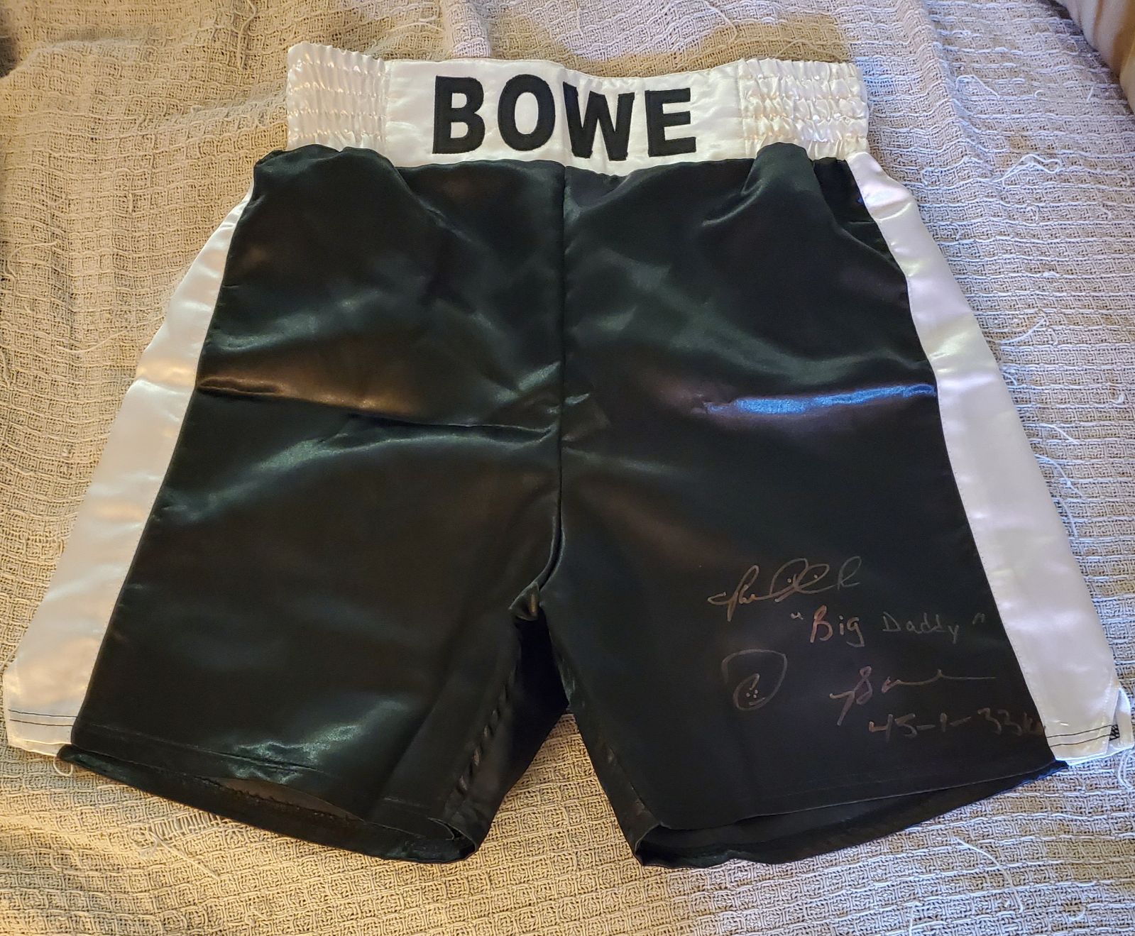 Riddick Bowe signed black boxing trunks