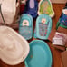 Numerous baby bath tubes and slings