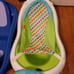 Numerous baby bath tubes and slings