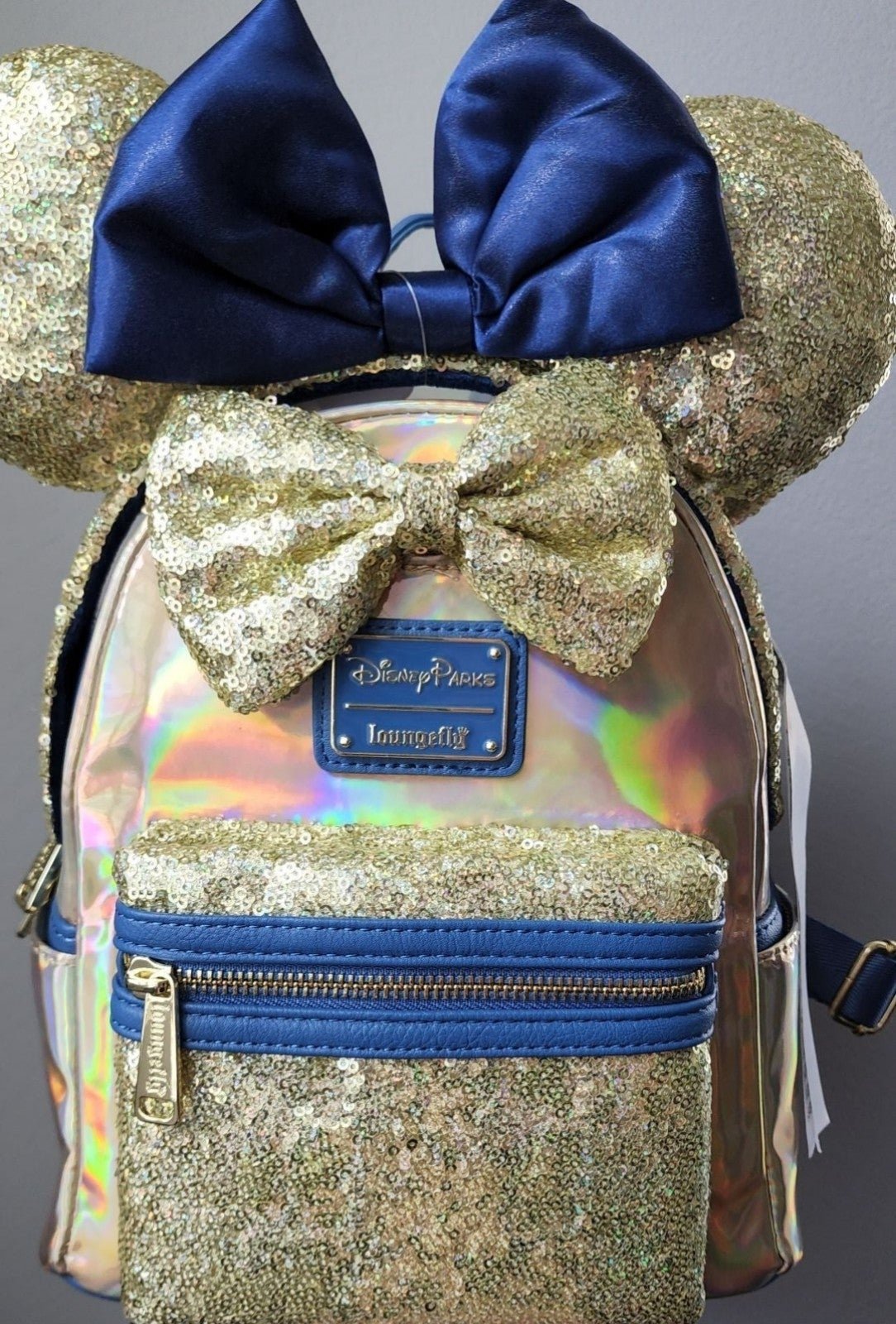 Blue/gold iridescent Loungefly backpack with matching ears