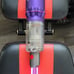 Dyson handheld vacuum with lighted crevice tool and 2-in-1 upholstery brush