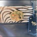 Emma Fox black leather satchel with floral interior and animal print accent