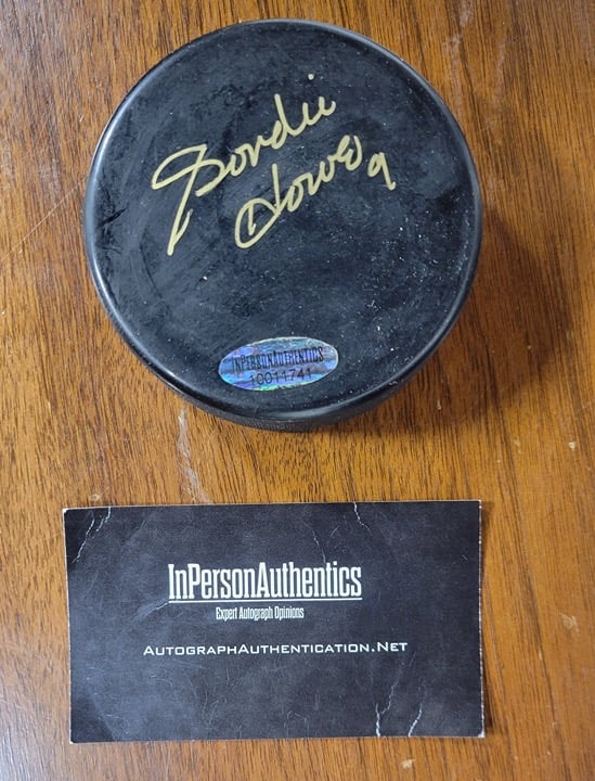 Autographed Gordie Howe Hockey Puck with a COA from InPersonAuthentics