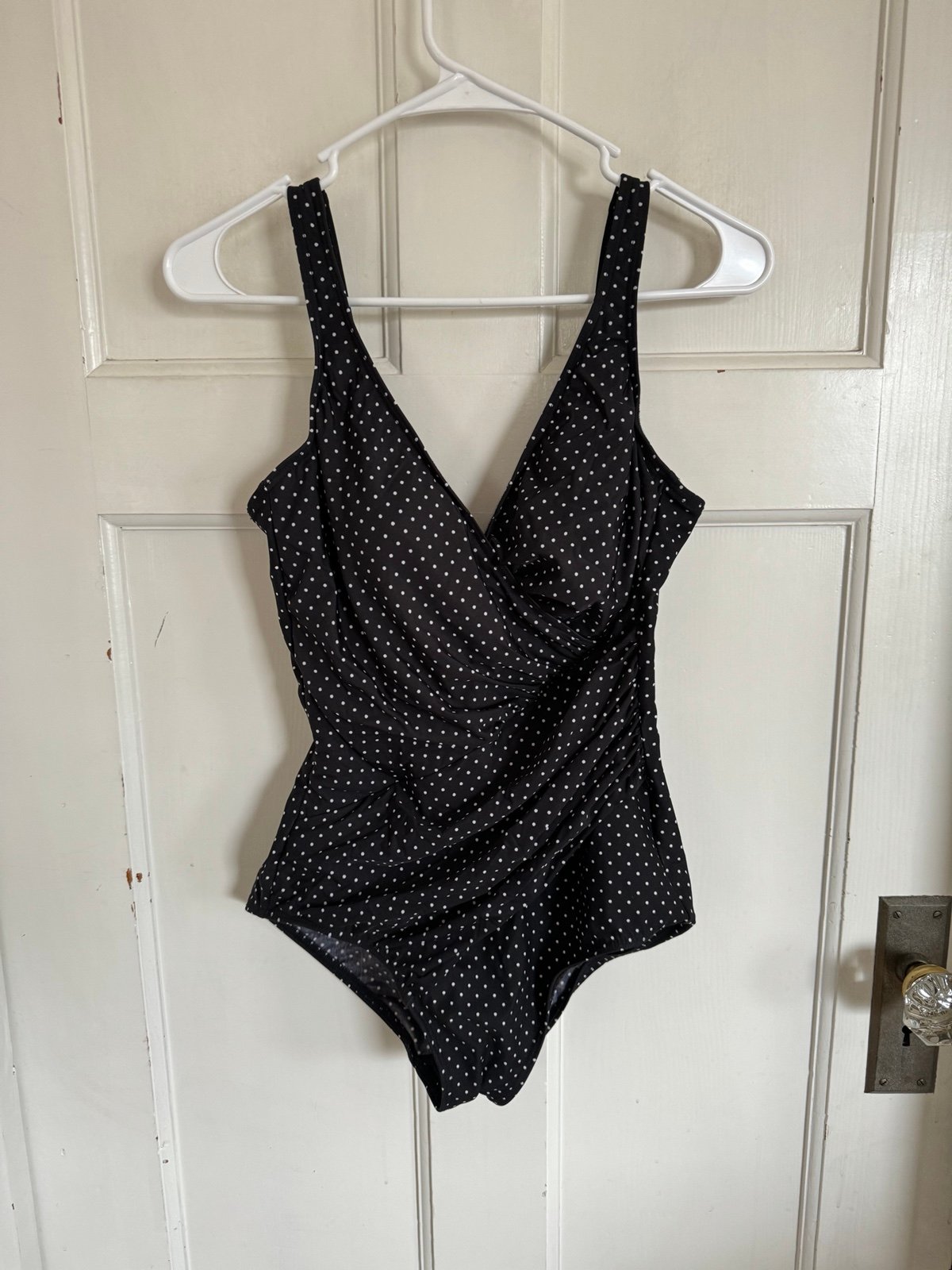 Miraclesuit black polka dot one piece swimsuit.