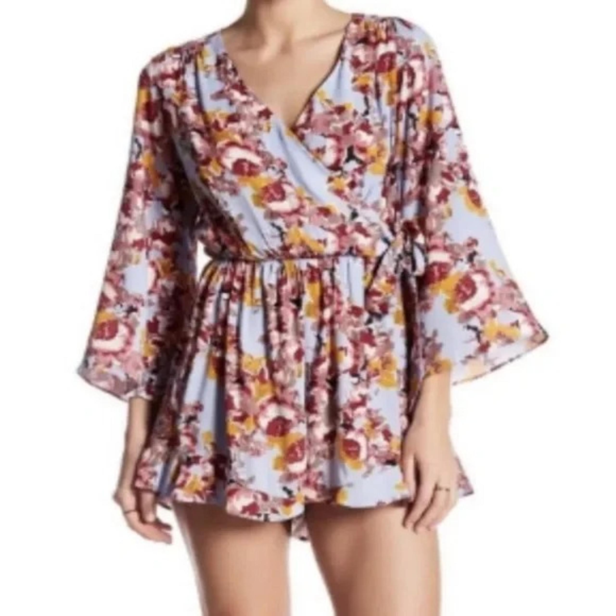 ASTR The Label Blue Floral Side Wrap Romper size XS with Pockets