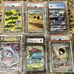 Mystery Pokemon Pack! 1 Random Graded Card + Atleast 1 Raw Hit! Value 25-140