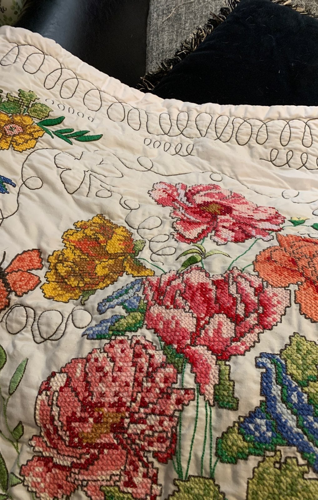 Hand embrorided and hand quilted lap thr