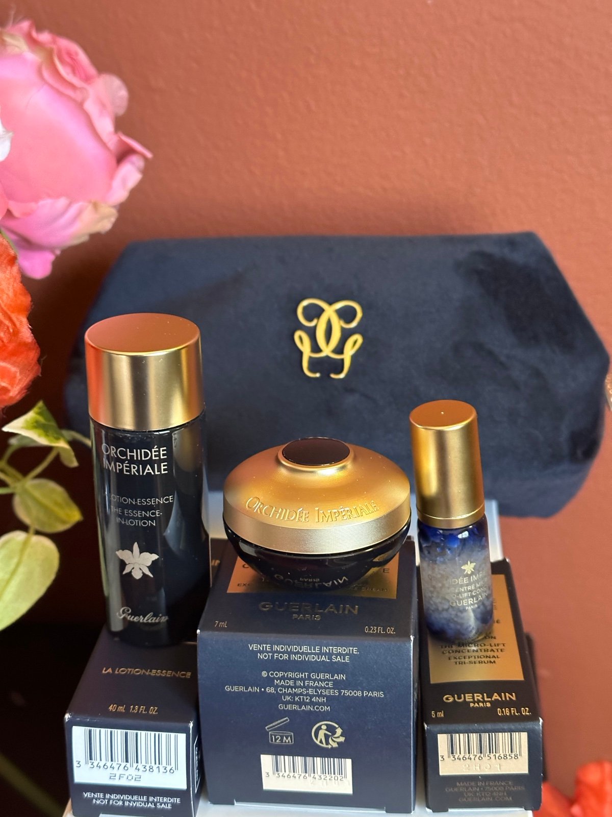 Guerlain face product and cosmetic bag