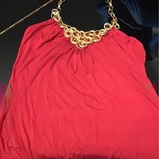 Red halter top with chain detail.