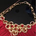 Red halter top with chain detail.