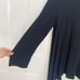 Bryn Walker black striped long sleeve blouse asymmetrical hems oversized