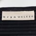 Bryn Walker black striped long sleeve blouse asymmetrical hems oversized
