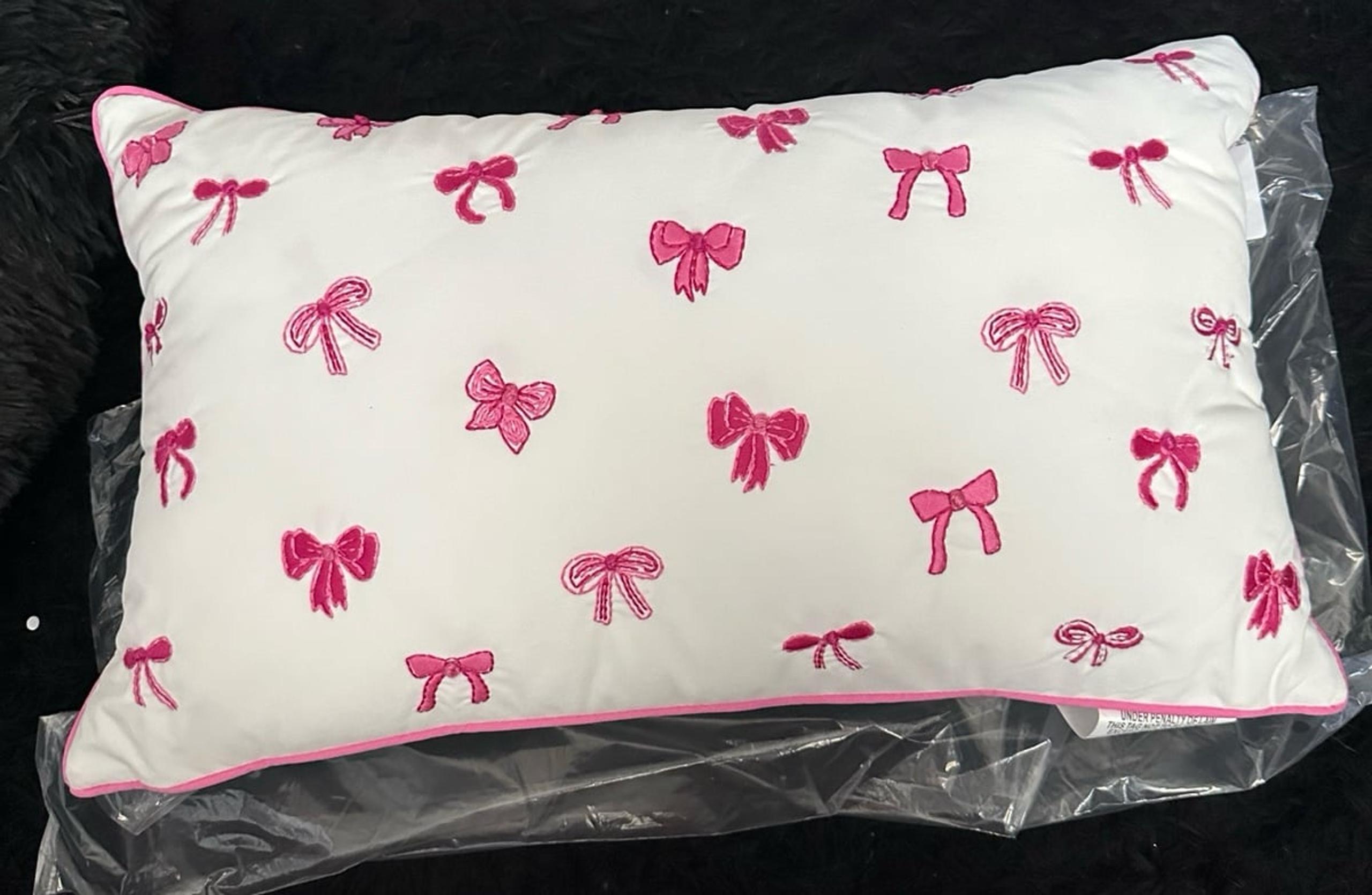 White & pink bow pillow