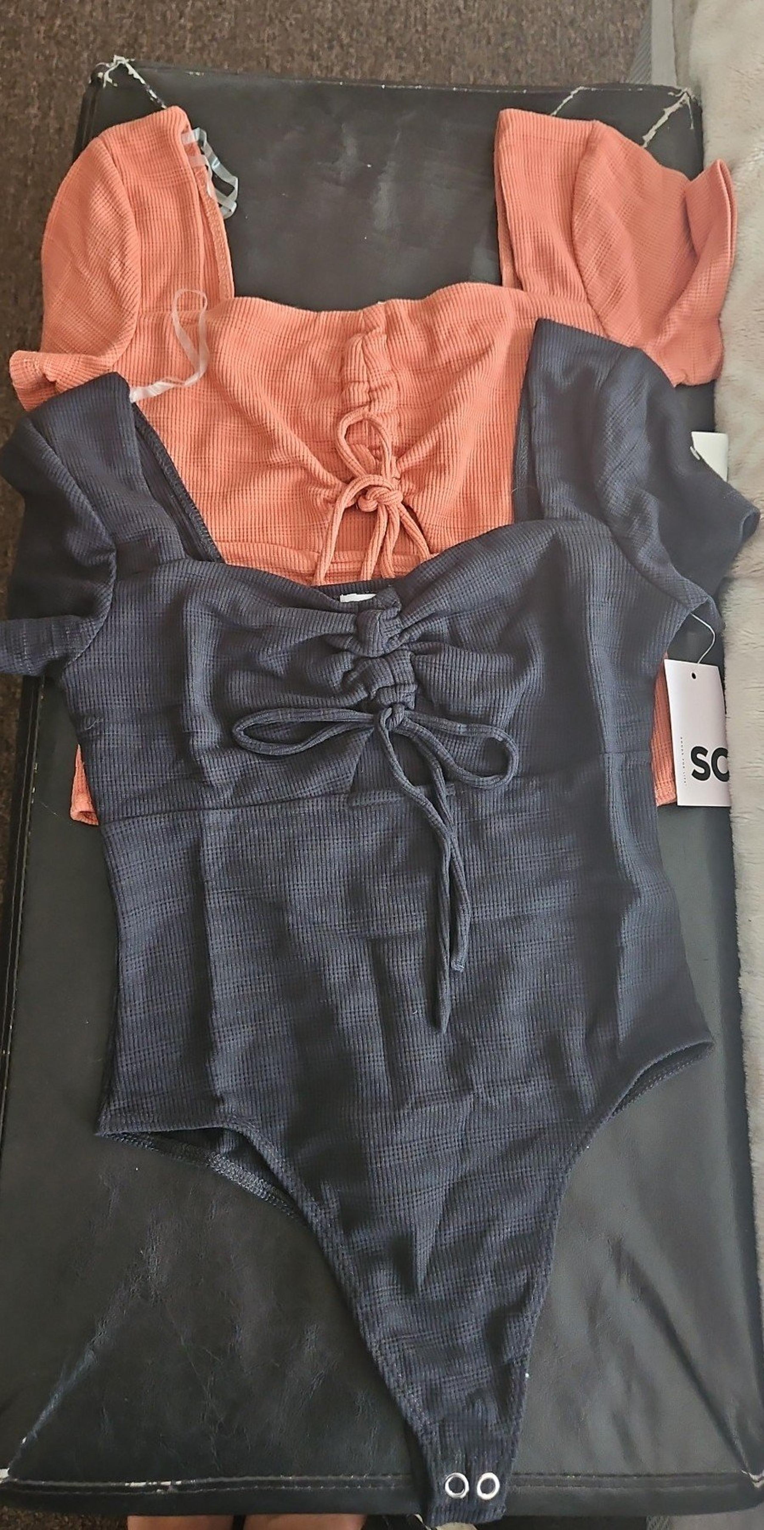2 So bodysuits small black and orange