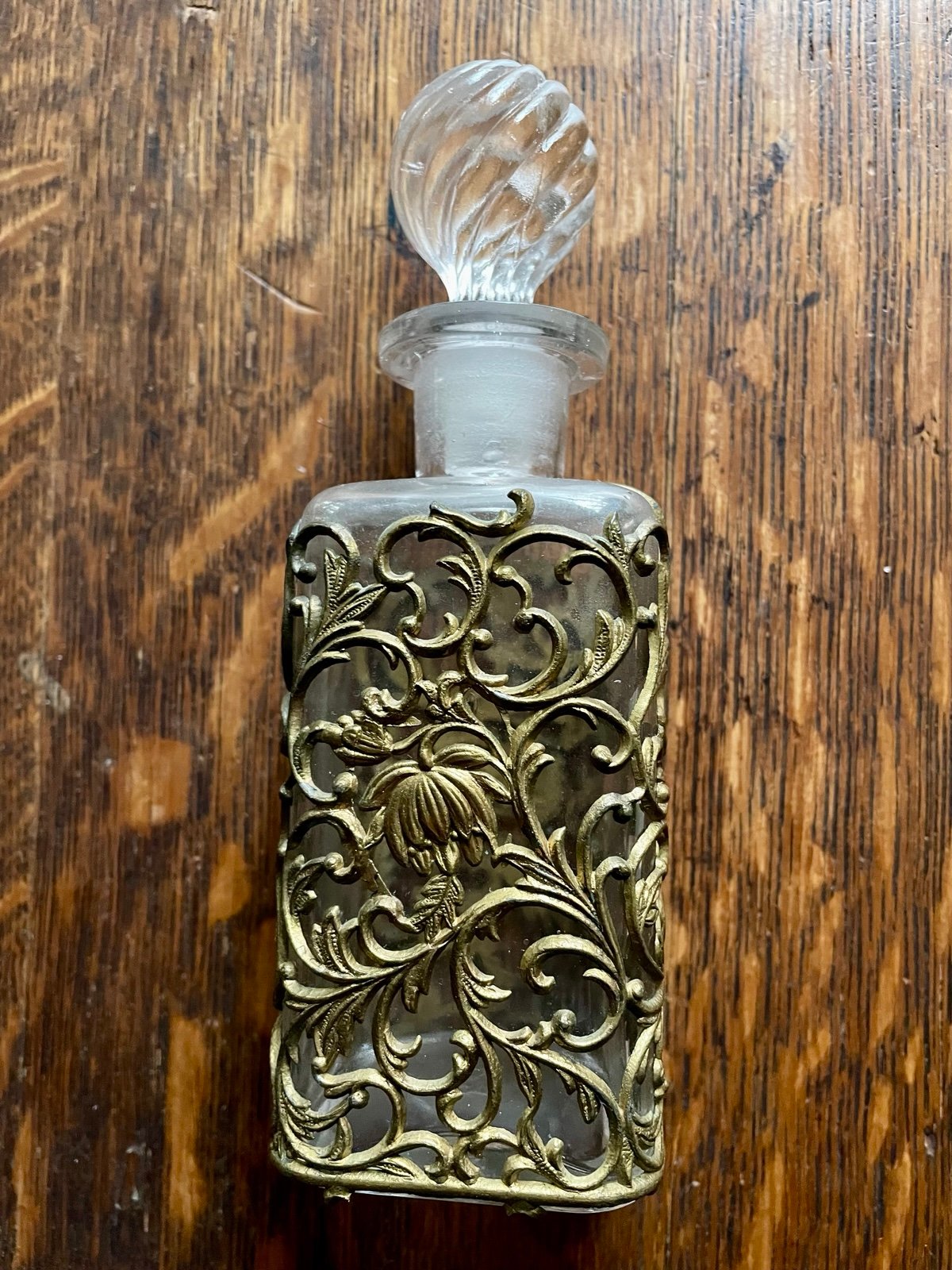 Vintage perfume bottle in brass metal filigree with crystal stopper 7.5”