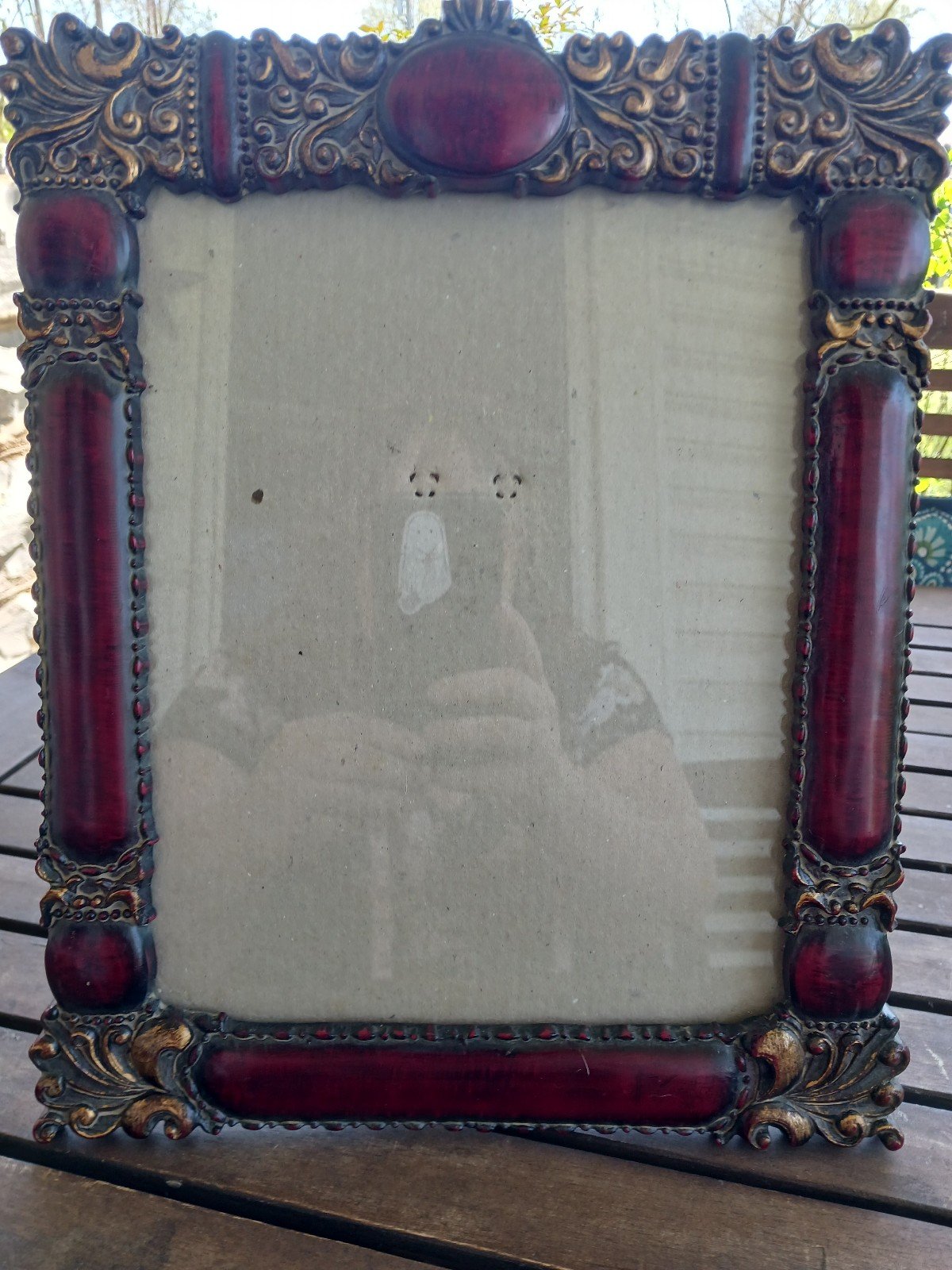 Antique red wood photo frame with gold scrollwork measures 10 x 12.5