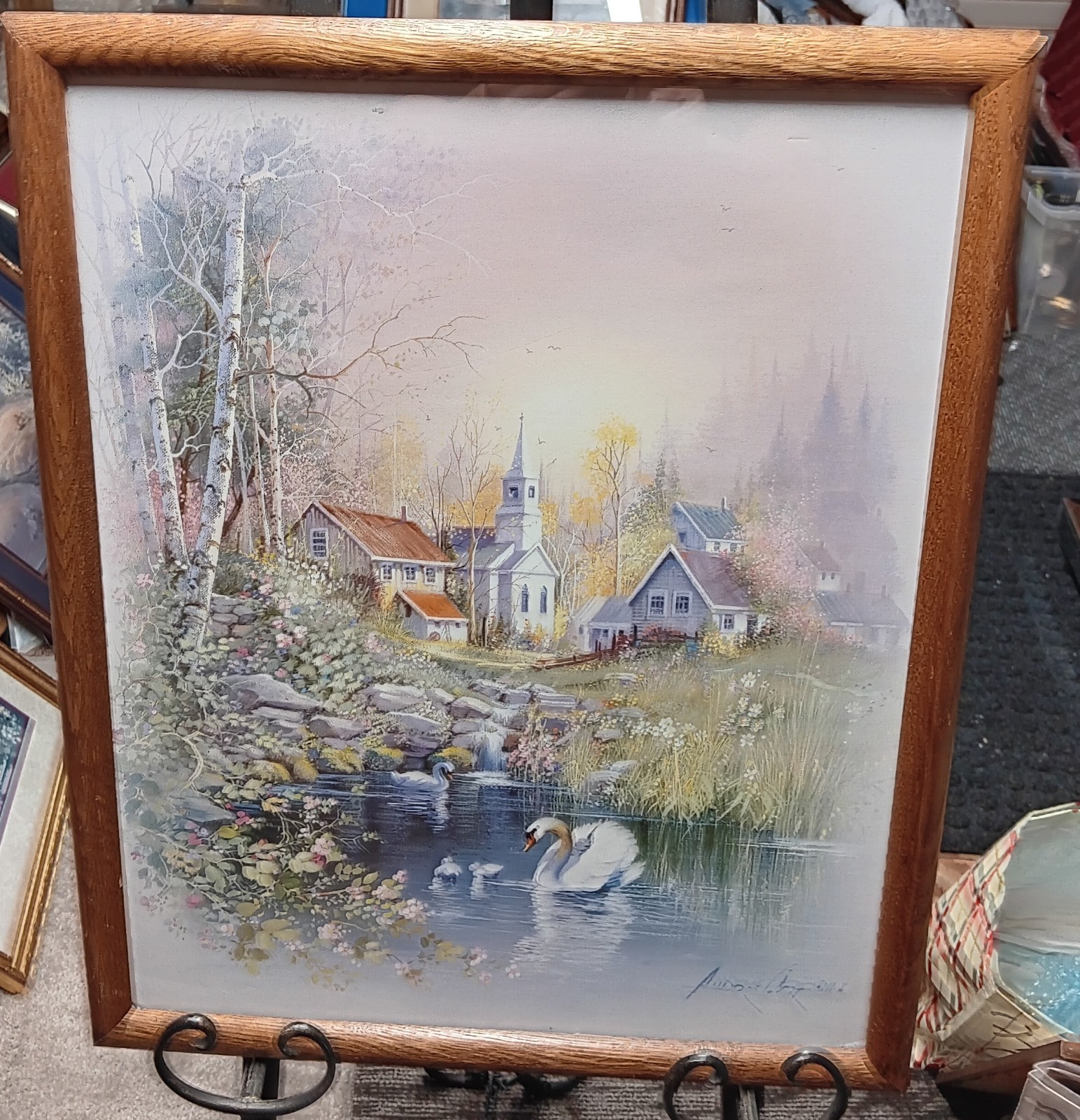 Framed print of swans on pond by artist Andres Oprinas.