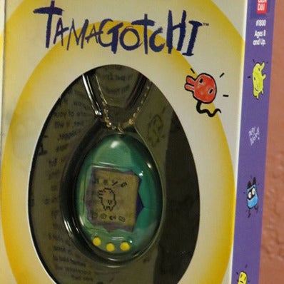 New in Box Original Bandai Tamagotchi Virtual Pet 1997 USA Release Teal/Yellow