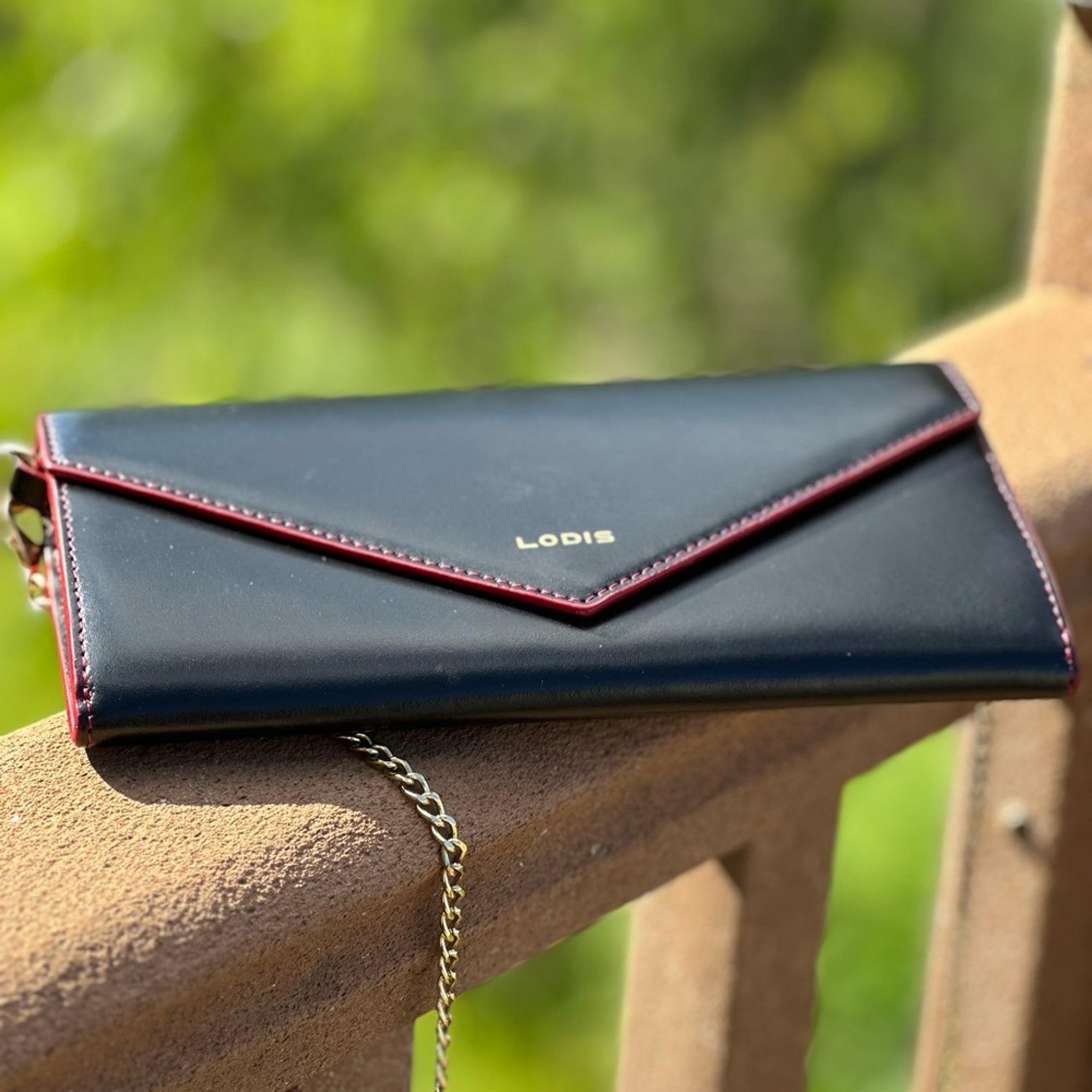 Lodis Black leather wallet with red inside, with 24” purse strap, EUC