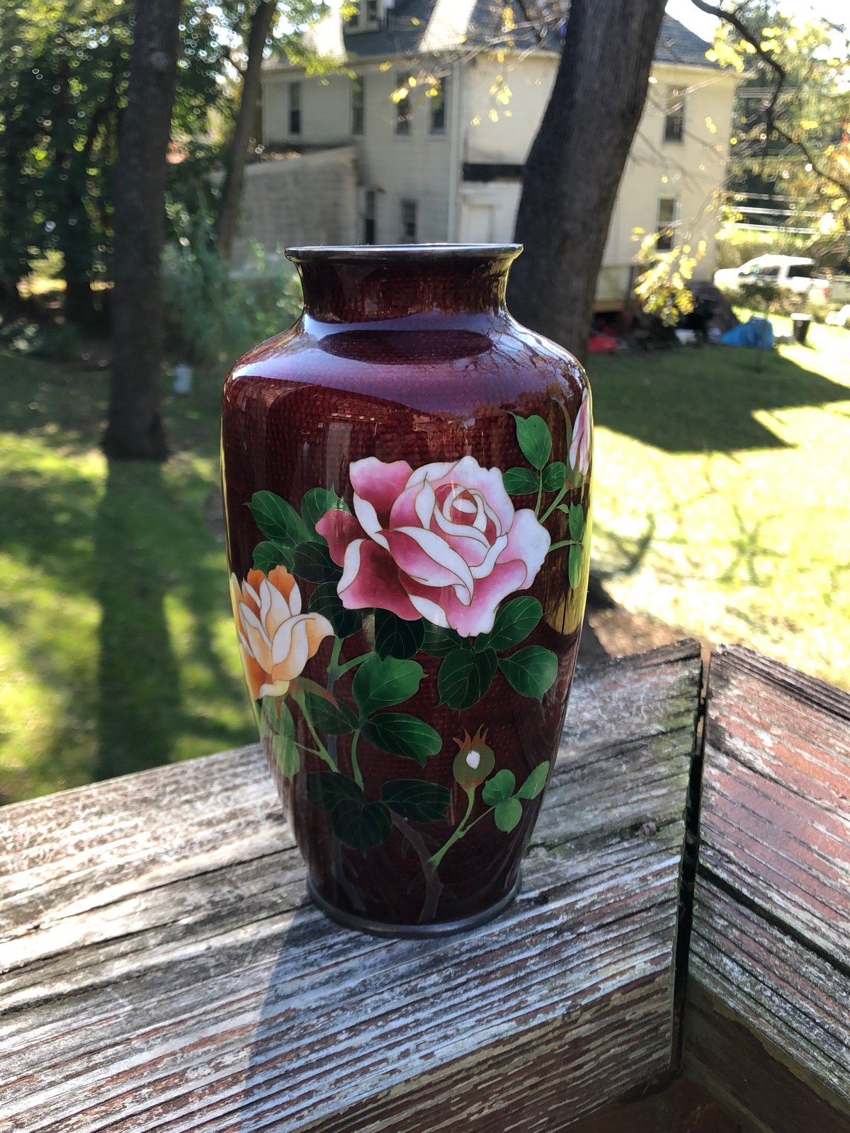 Vintage blood red enamel vase with roses