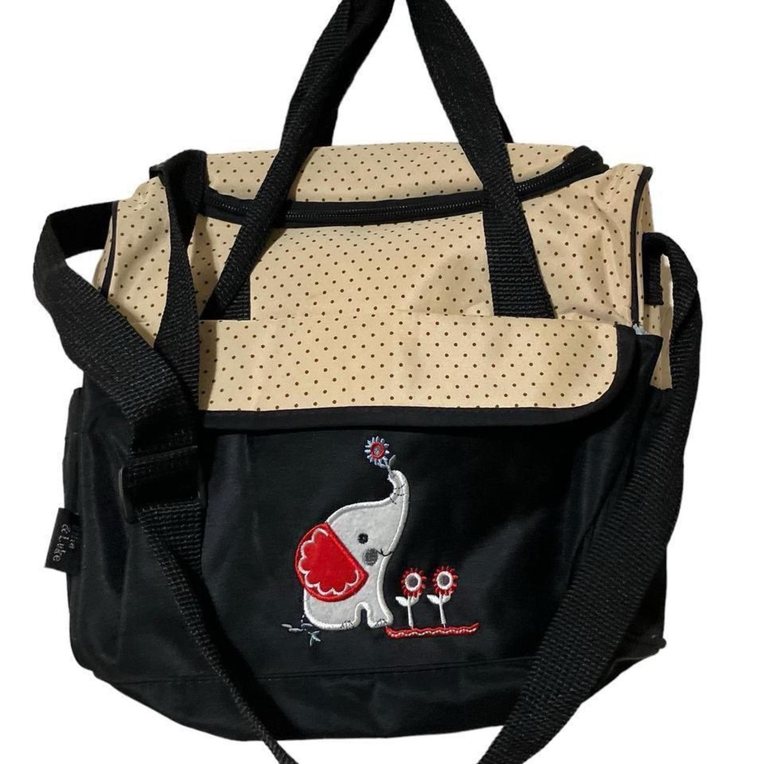 Elephant tan and navy used condition diaper bag