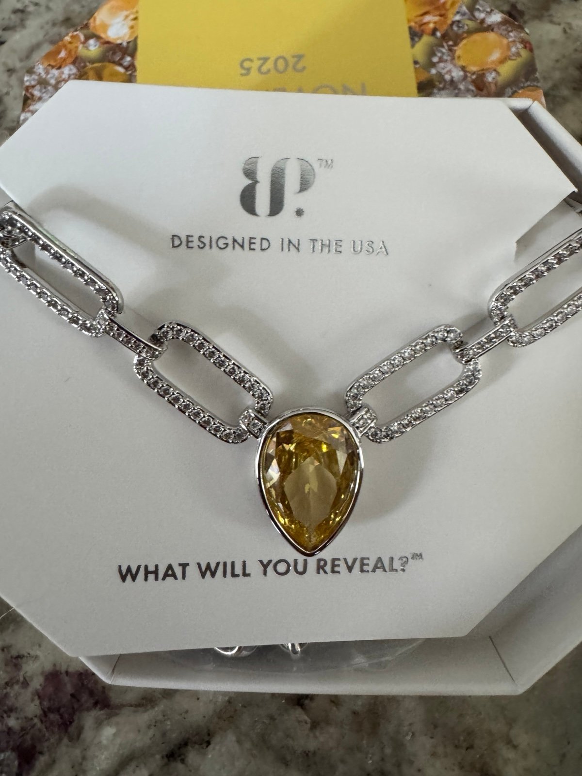 Bomb Party BP November 2025 Rhodium Citrine Necklace Held In Flight