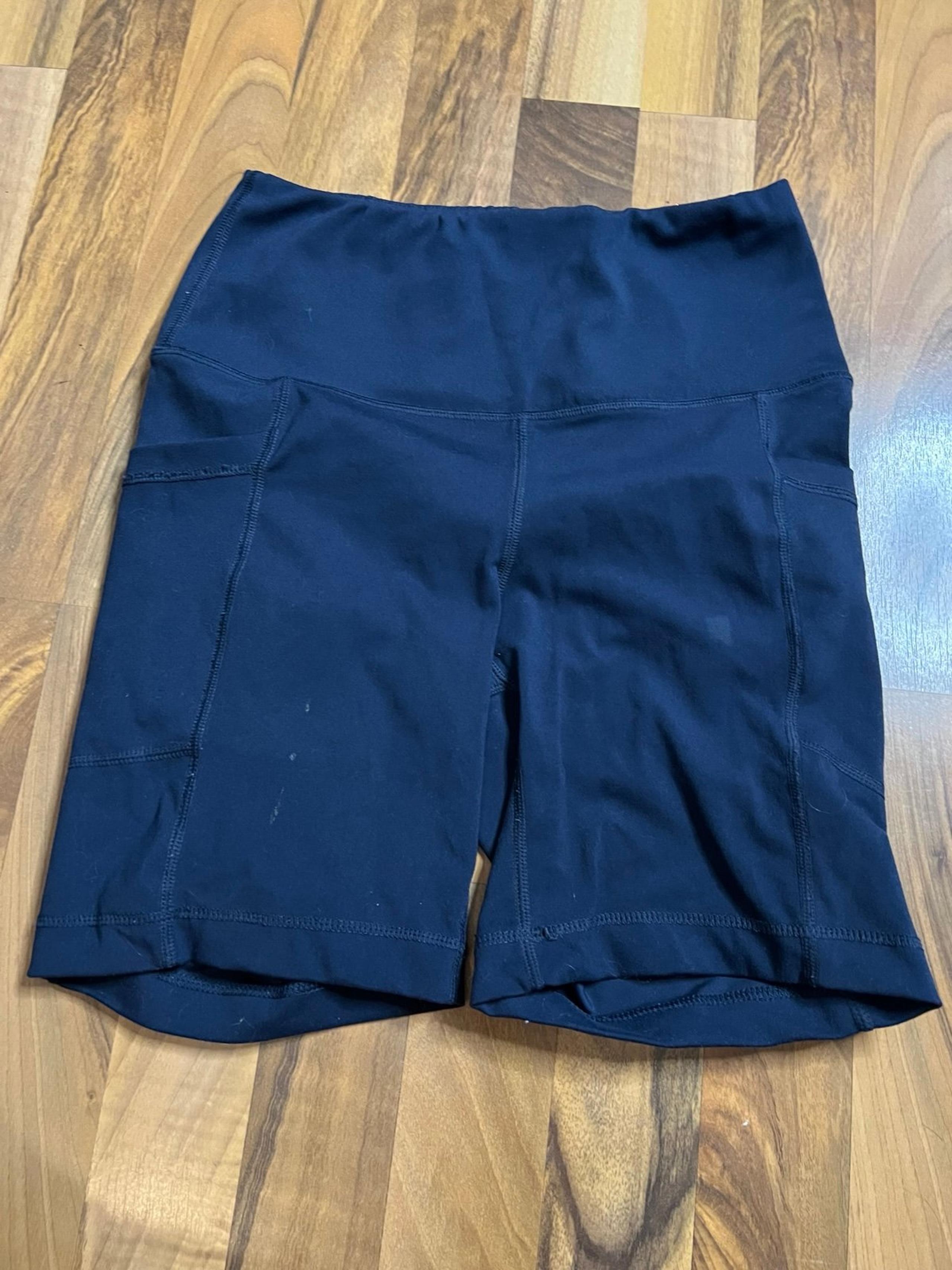 Navy blue mid length athletic shorts