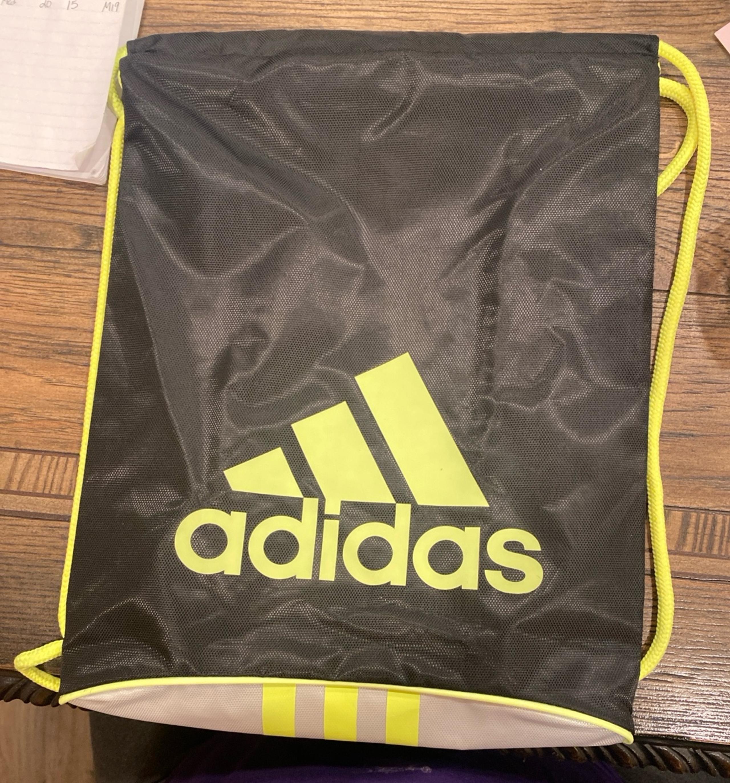 Adidas drawstring backpacks yellow,black and white