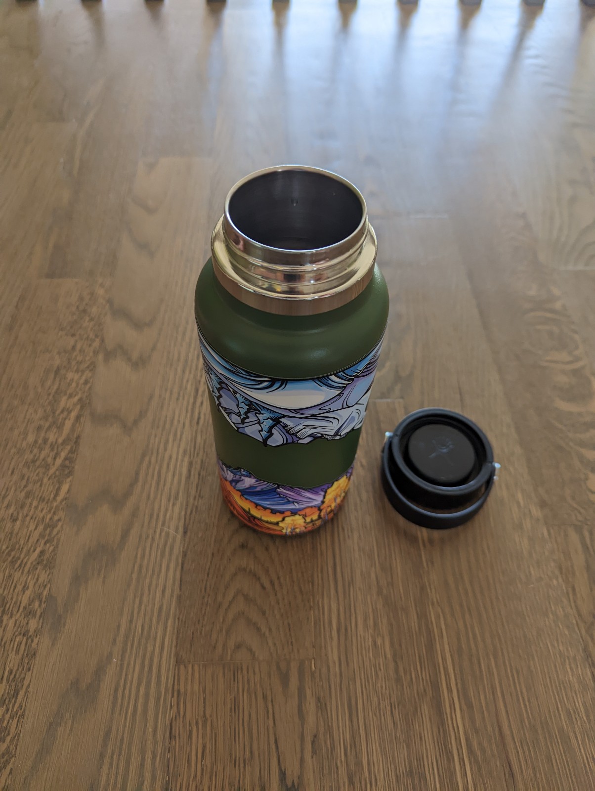 New hydro flask with rap-around stickers of The flat irons in Boulder, Colorado.