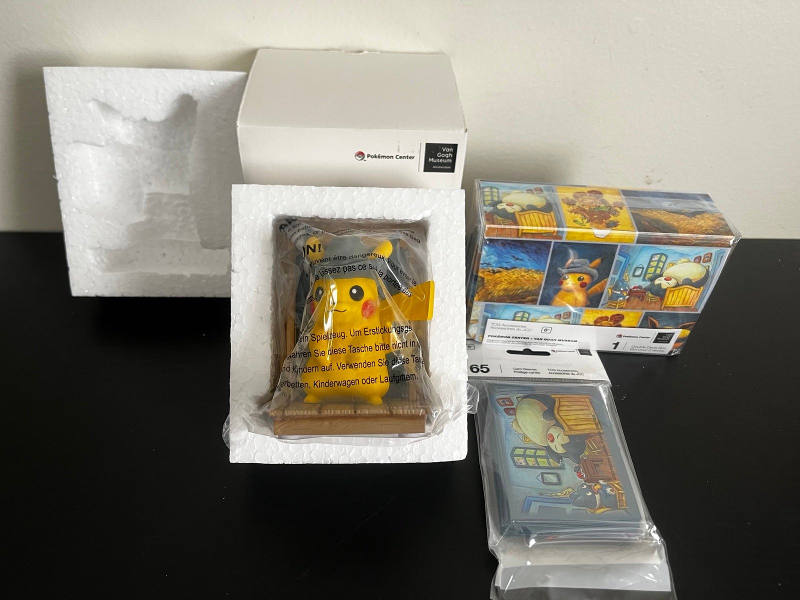 Pokémon Van Gogh Pikachu figure, 1 snorlax card sleeves, 1 pokémon dd box