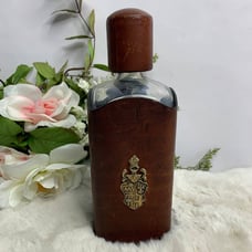 Vintage Handcrafted Leather Covered Glass Bottle With Cap And Metal Emblem