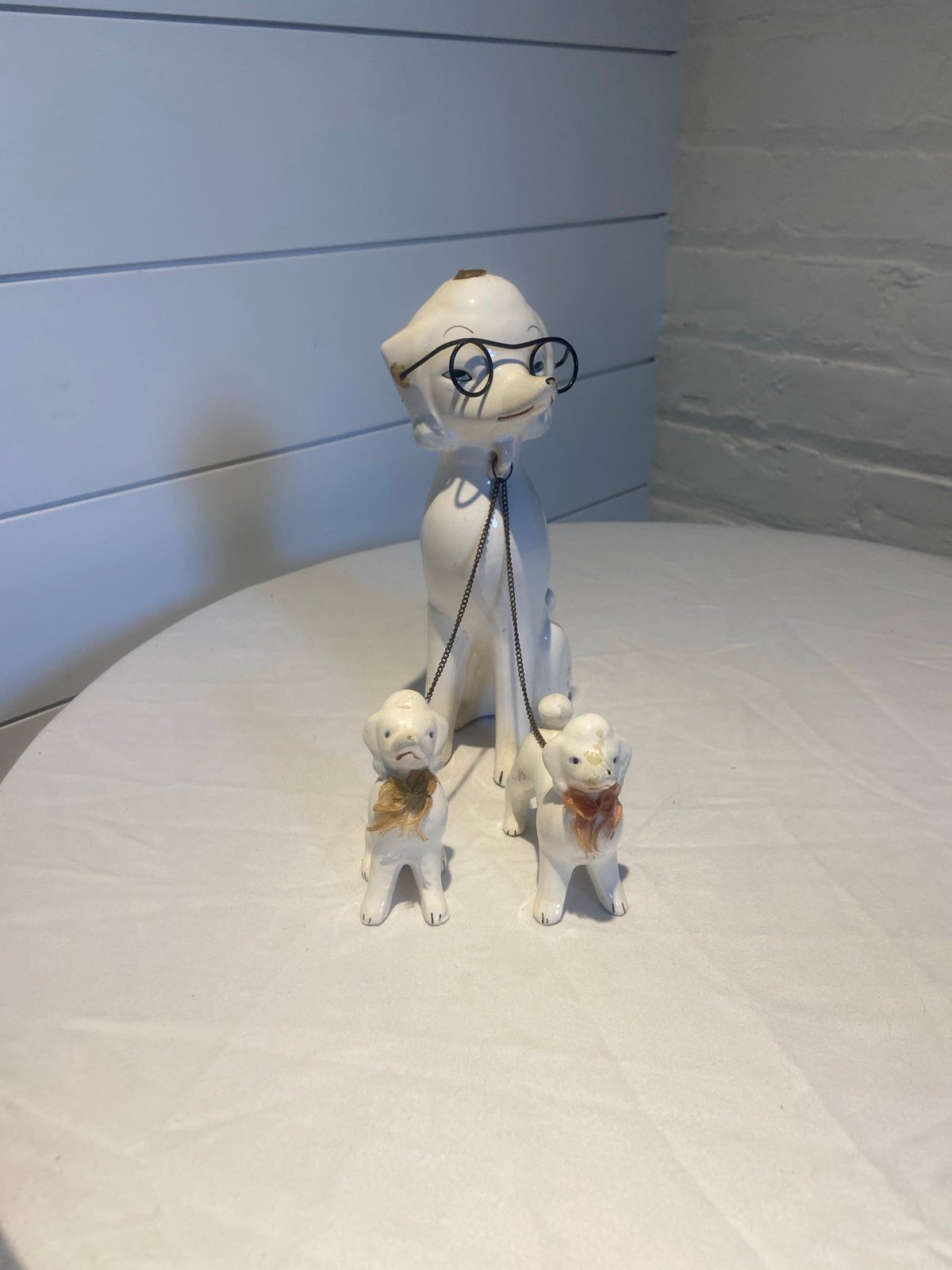 3 pc. Vintage porcelain poodle with glasses and puppies on a chain