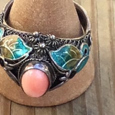 Sterling silver with enameled sides and coral center stone