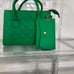 green leather purse